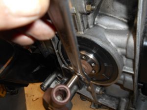 21. Tightening the screw with a spacer.