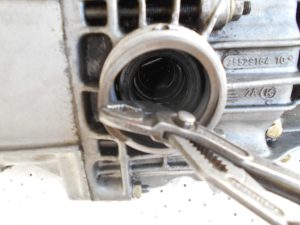 27. Removing an output shaft seal retaining ring.