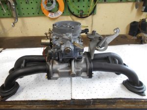 40. Refitting the carburetor after cleaning.